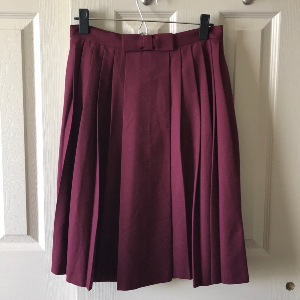 Feminine and chic. Deep burgundy pleated skirt